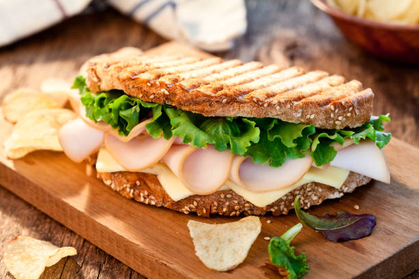 istock Ham And Cheese Sandwich With Chips 1169351901
