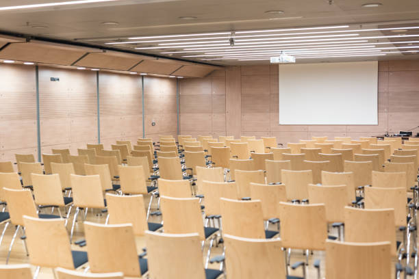 istock Empty wooden seats in a cotmporary lecture hall. 1169352062