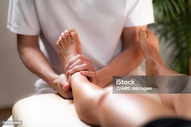 Leg Pain Osteopathy Treatment Stock Photo - Download Image Now - Massaging, Physical Therapy, Foot