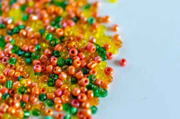 Mix of fall colors seed beads, texture background