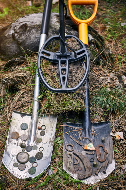 istock Search for treasure using a metal detector and shovel. 1169363409