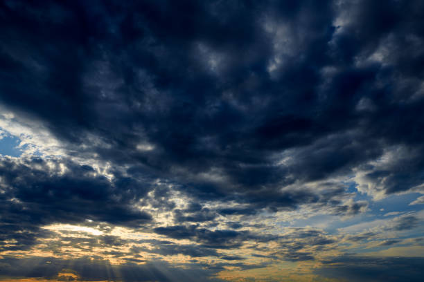 istock Beautiful sunset - dark sky with clouds and sunlight 1169364801