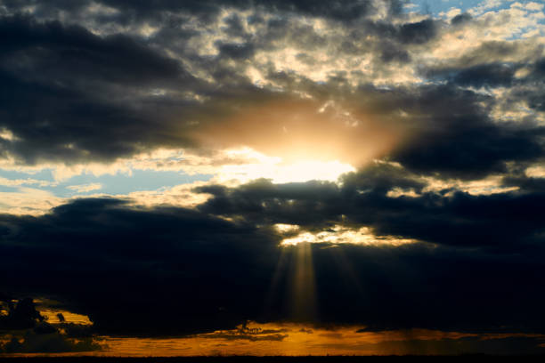istock Beautiful sunset - dark sky with clouds and sunlight 1169364979