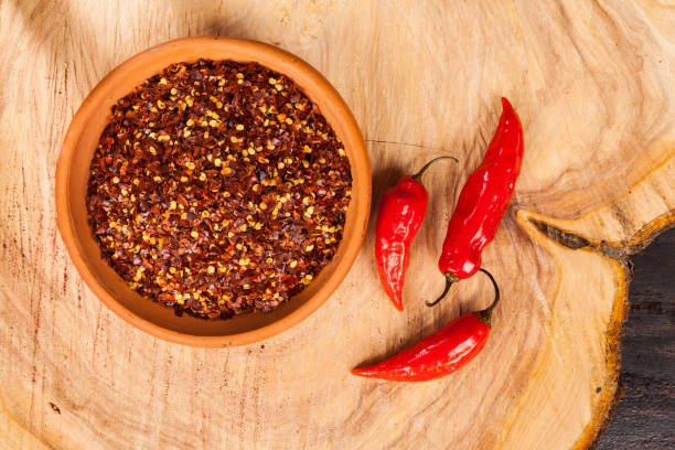 istock red pepper or cayenne pepper crushed with flakes scattered 1169365316
