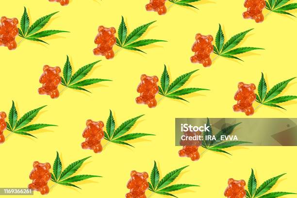 Pattern Gummies In Form Of A Bear With Cbd Oil On A Yellow Background Minimum Cbd Concept Stock Photo - Download Image Now