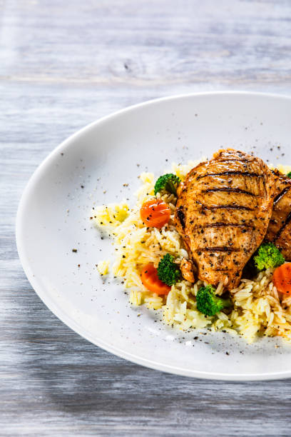 istock Roast chicken filets with rice and vegetables 1169366880