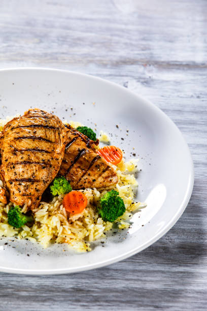 istock Roast chicken filets with rice and vegetables 1169366926