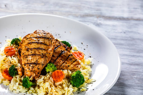 istock Roast chicken filets with rice and vegetables 1169366941