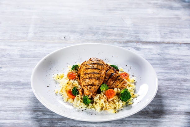 istock Roast chicken filets with rice and vegetables 1169366951