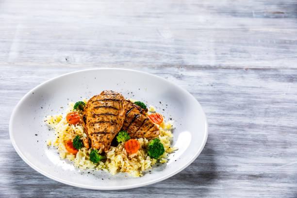 istock Roast chicken filets with rice and vegetables 1169367050