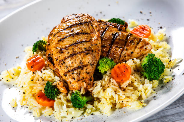 istock Roast chicken filets with rice and vegetables 1169367603
