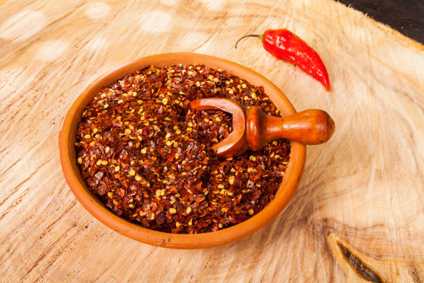 istock red pepper or cayenne pepper crushed with flakes scattered 1169367954