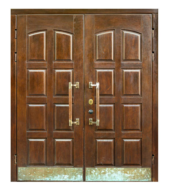 istock New big wooden oak doors with brass handles. 1169368078