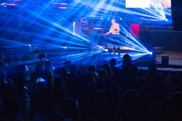 istock Dj playing techno music on the stage 1169370075