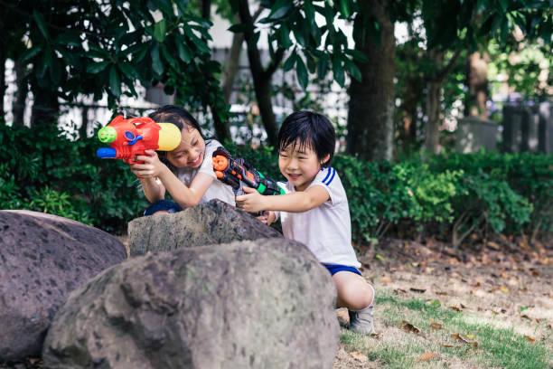 istock The children with squirt gun 1169370217