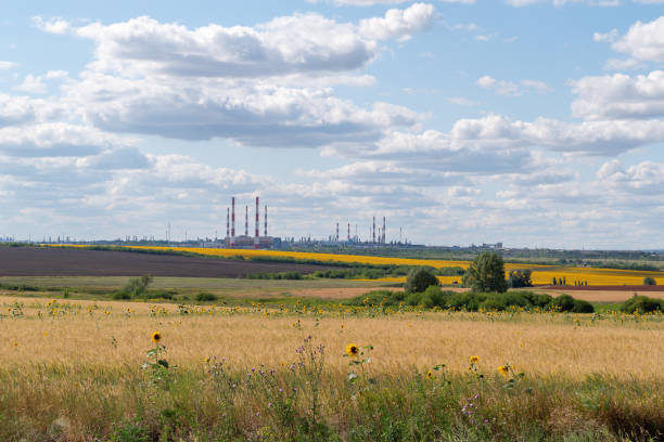 istock Industrial facility among agricultural land 1169371617