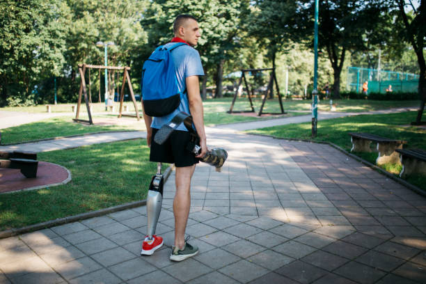 istock Sportsman disability guy holding his leg 1169374987