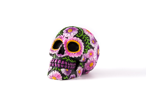 Typical Mexican skull painted isolated on white background.Copyspace. Dia de los muertos.