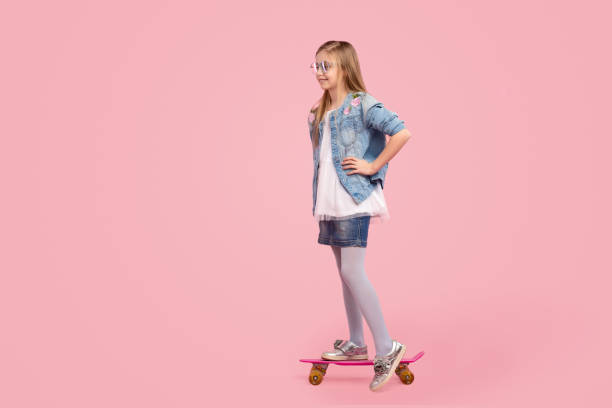 istock Little kid riding skateboard 1169378127