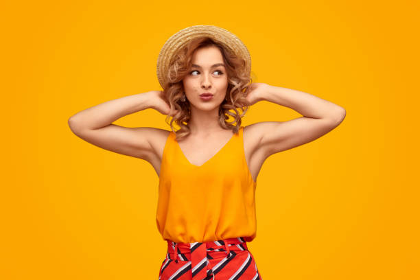 istock Stylish woman in hat looking away 1169378189