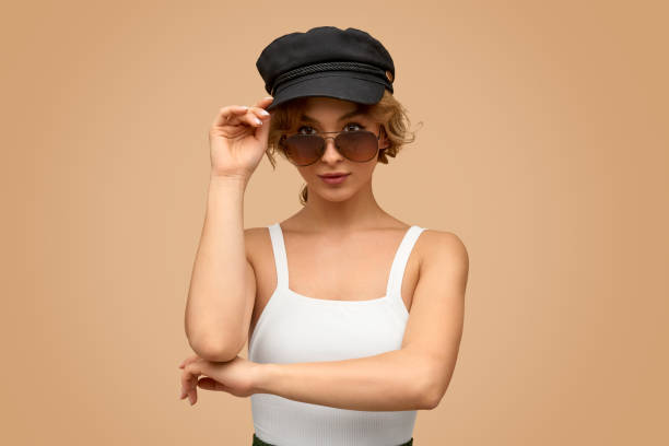 istock Trendy female adjusting cap 1169378208