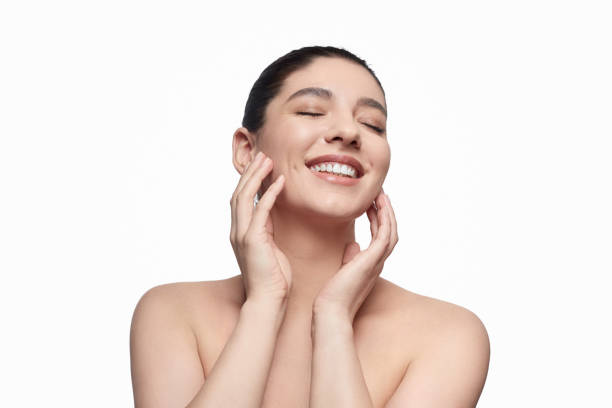 istock Cheerful lady touching clean face 1169378238
