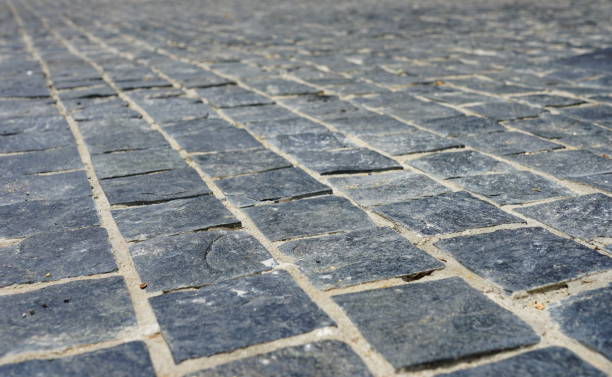 istock Pedestrian crossing with stone texture 1169380001