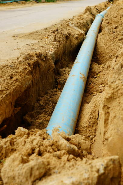 istock Long blue plastic sewer pipes on road 1169380256