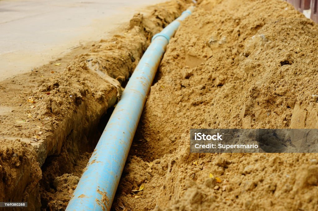 Blue Pipeline Building - Activity, Built Structure, Construction Industry, Dirt, Industry Sewer Stock Photo