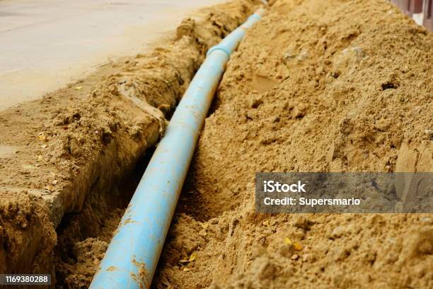 Blue Pipeline Stock Photo - Download Image Now - Sewer, In A Row, Waiting In Line