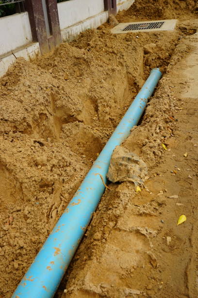 istock Long blue plastic sewer pipes on road 1169380347