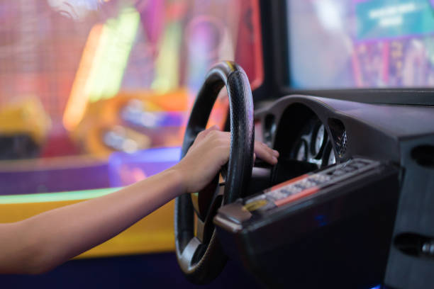 istock Happy Boy PlayingCar Racing Video Game 1169381313
