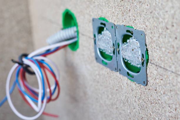 istock different wires in electrical outlet and switches on the wall 1169381321