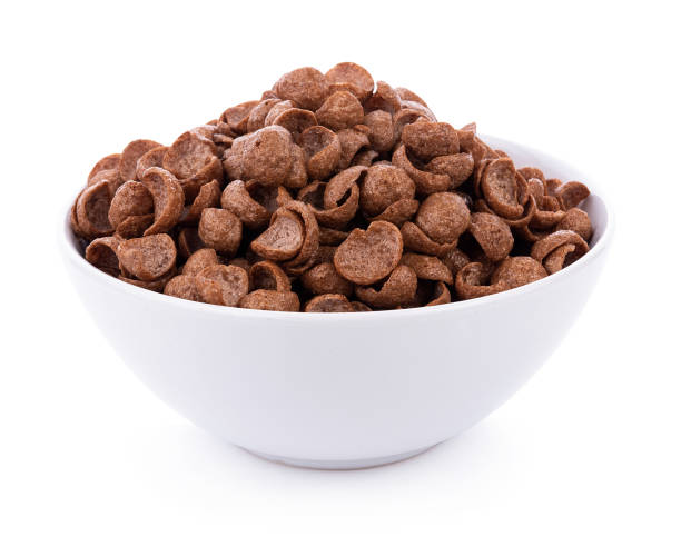 istock chocolate cereals in bowl on white background. Cornflakes 1169382579