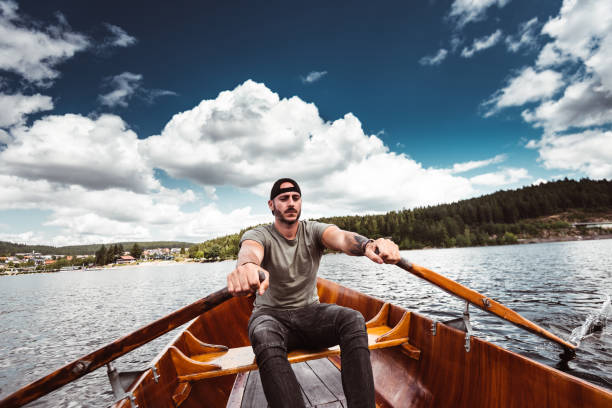 istock man rowing in the lake 1169382899