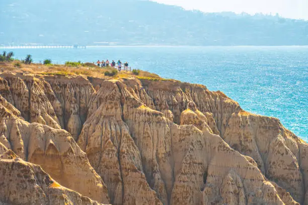 Coastline sandstone cliffs by the ocean at Torrey Pines State Park and Reserve in La Jolla, San Diego in southern California. Captivating views of unique landscape rock formation along the beach coast