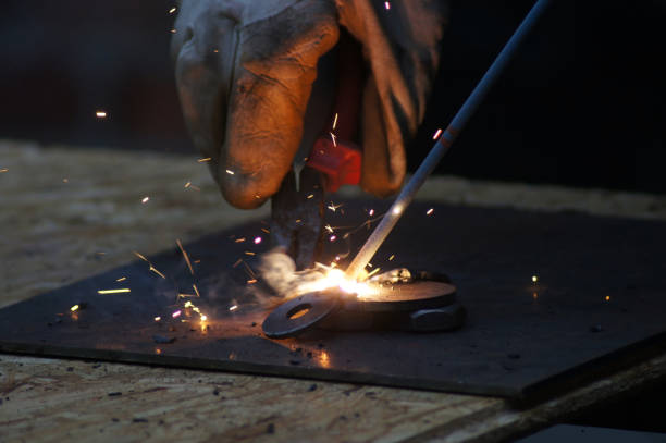 istock Metalworkers welders at work in industry 1169386119