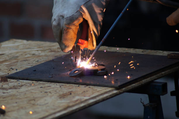 istock Metalworkers welders at work in industry 1169386123