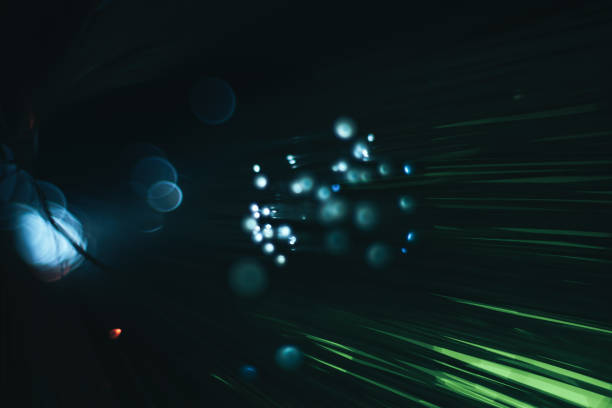 istock Beautiful abstract fiber optical network cable on a red glow background. 1169392843