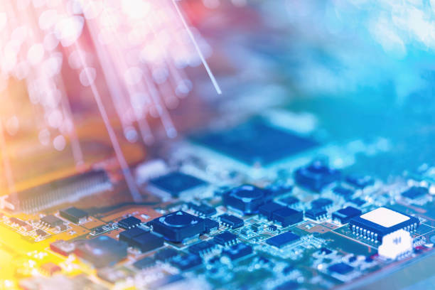 istock Closeup on electronic board and neon electric lights, blurred and toned electronic background 1169392968