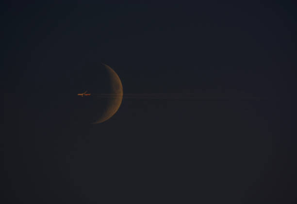 moon and plane Airplane with Moon in background contrail moon on a night sky stock pictures, royalty-free photos & images