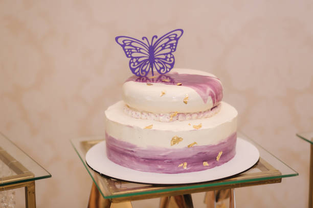 istock Beautiful cake decorated by batterfly. White and violet 1169404660