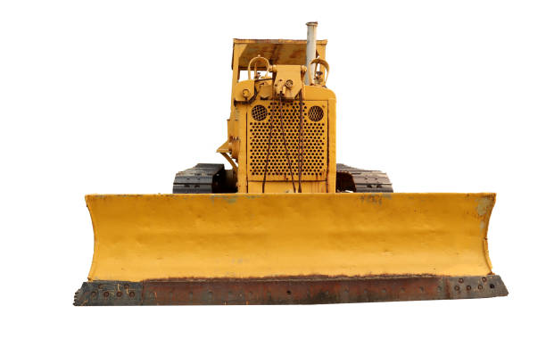istock Old yellow rusty crawler tractor in the field. Old crawler tractor 