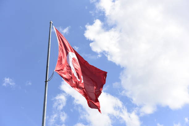 istock Turkish flag waving in the sky 1169406726