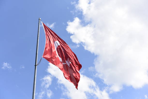 istock Turkish flag waving in the sky 1169406728