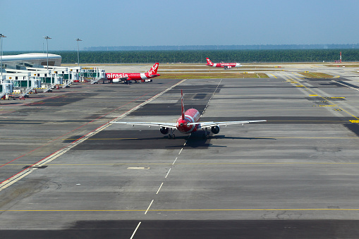 Sepang, Selangor, Malaysia - Mart 17, 2019: Aircraft low-cost carrier of Air Asia are preparing to flying at Kuala Lumpur International Airport, Terminal 2 'KLIA2'