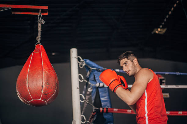istock Muscular man boxing at the gym 1169410866