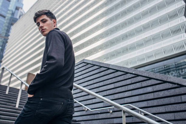 istock Handsome man walking on stairs 1169413277