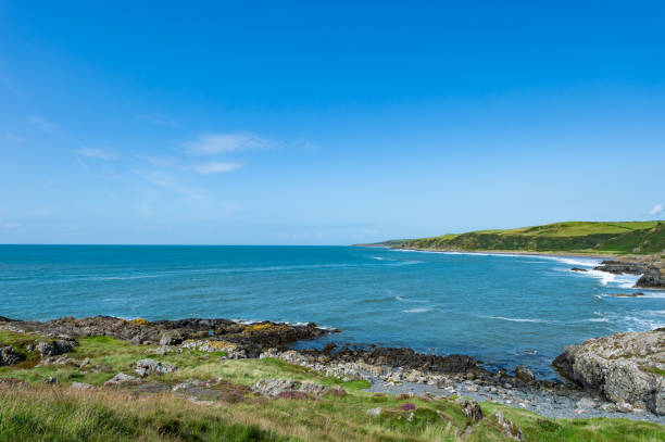 istock Waves breaking onto rugged Scottish coastline 1169413282