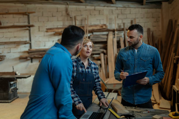 istock Carpenters Focused on Planning Woodworking Project 1169415666